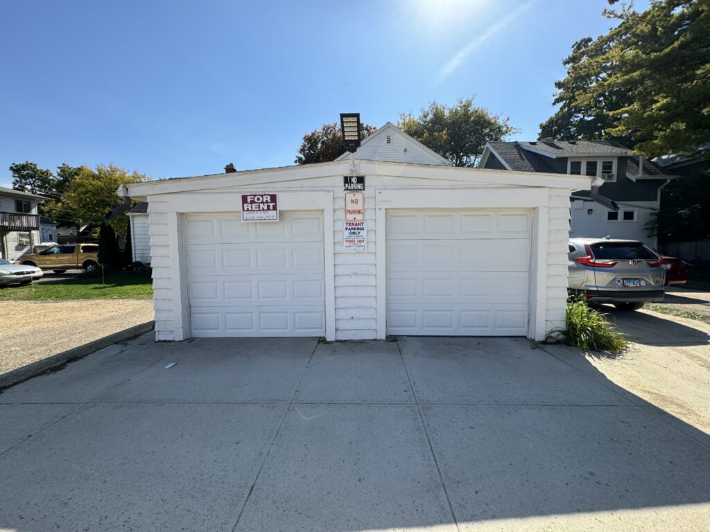 A white garage with two stalls located at 1208 bowen ct.